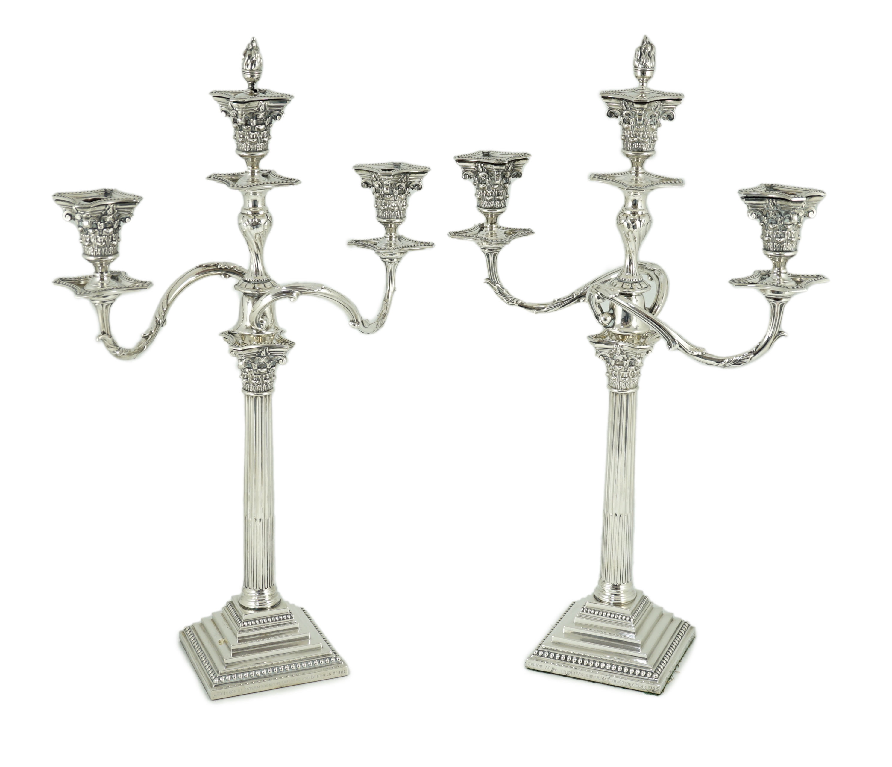 A pair of late Victorian silver two branch, three light Corinthian column candelabra, by Aldwinckle & Slater